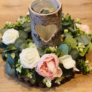 Floral wreath and bark candle holder centrepiece.