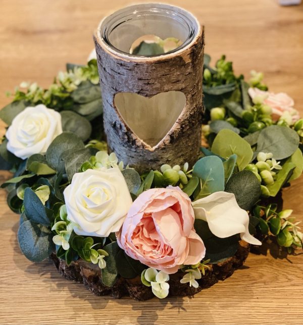 Floral wreath and bark candle holder centrepiece.